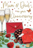 The illustration on this anniversary card creates a warm, romantic still life, easily imagined on a small table in a Somers Town flat after a quiet meal and shared stories. Two graceful champagne flutes stand side by side at the back, slightly angled toward each other as though they're about to meet in a gentle clink. The clear glass is drawn with soft reflections and glints of light, while the champagne inside glows with a pale golden colour, animated by tiny, rising bubbles that give a sense of joyful motion. Just in front, a heart-shaped chocolate box in a deep, luxurious red rests open, offering a neatly arranged collection of chocolates. Each piece is shaded to reveal smooth, rounded forms and subtle highlights, suggesting rich fillings and indulgent flavours. A generous red ribbon encircles the box, its bow full and soft, with curling ends that spill across the table like satin. To the side, two deeply coloured red roses lie gently on the surface, their velvety petals unfurling in layers that echo the curves of the heart-shaped box. The leaves are a strong, fresh green, making the roses look as if they've just come from a Somers Town florist, ready to be delivered to a long-loved couple nearby. A bright scarlet envelope rests nearby, sealed and slightly tilted, hinting at a handwritten anniversary message brimming with affection. Floating around the central elements are delicate crimson and gold hearts and soft, looping script that adds a playful yet tender energy. Altogether, the card radiates warmth, romance, and gratitude, perfectly capturing the sweetness and sparkle of a shared anniversary moment.